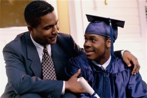 680-02431878 © Masterfile Royalty Free Model Release: Yes Property Release: No Close-up of a young male graduate sitting with his father